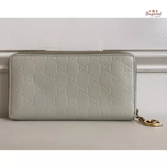 Authentic GUCCI Cream Guccissima Leather Interlocking G Heart Zip Around Wallet - Picture 3 of 12